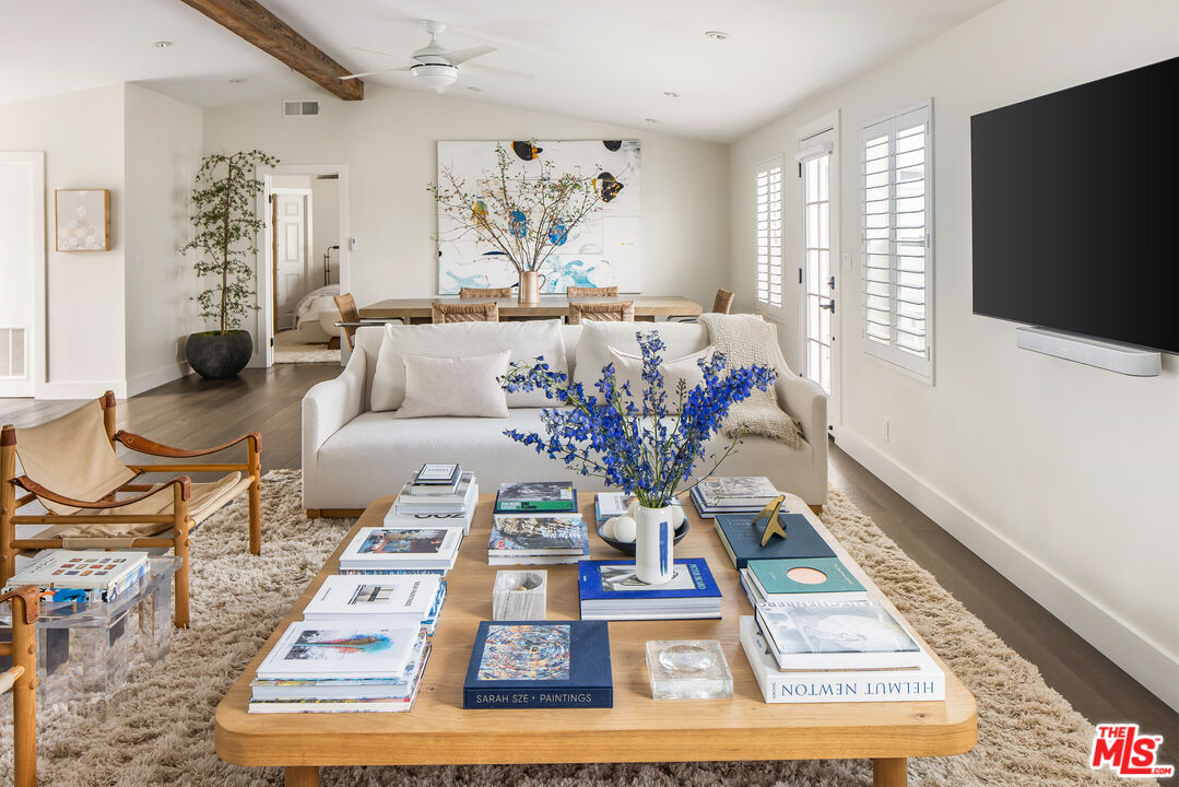 29500 Heathercliff Road, Unit 235 Malibu, CA 90265 - Photo 2 of 32 a living room with furniture and a flat screen tv