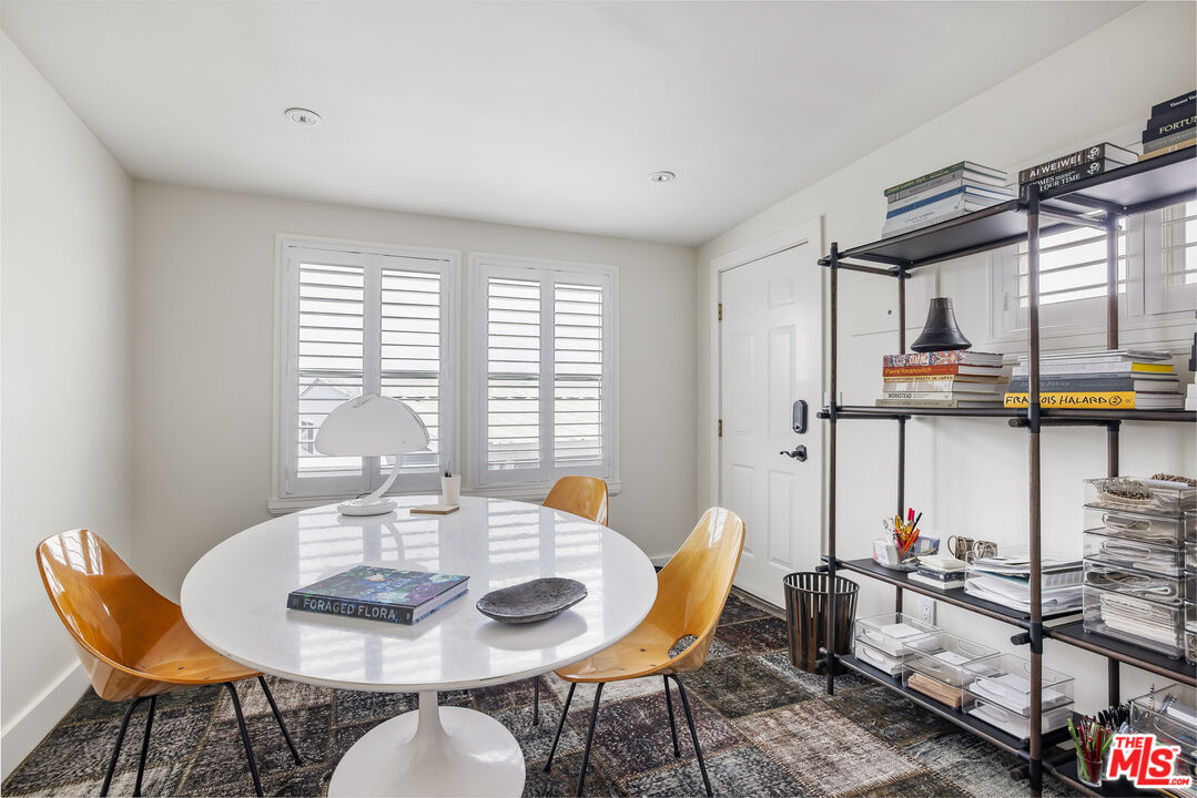 29500 Heathercliff Road, Unit 235 Malibu, CA 90265 - Photo 22 of 32 a dining room with furniture and window