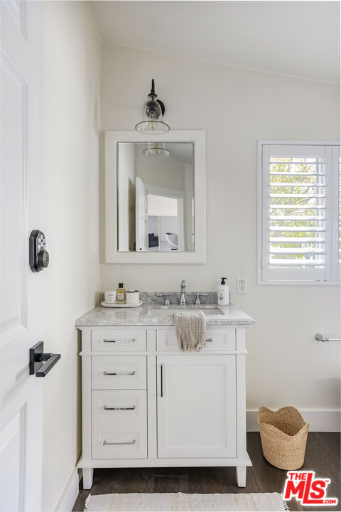 29500 Heathercliff Road, Unit 235 Malibu, CA 90265 - Photo 25 of 32 a bathroom with a sink toilet and mirror