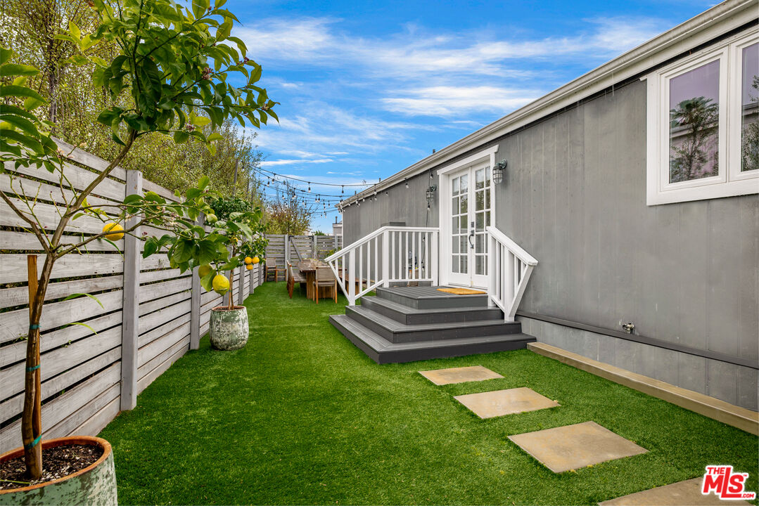29500 Heathercliff Road, Unit 235 Malibu, CA 90265 - Photo 26 of 32 a front view of a house with garden