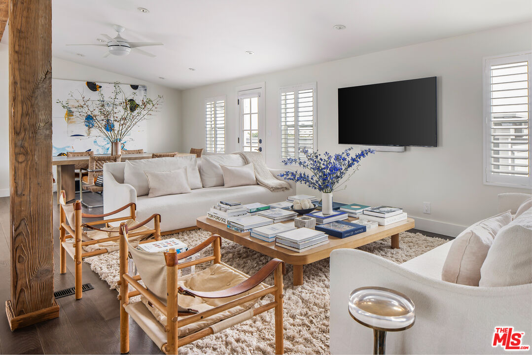 29500 Heathercliff Road, Unit 235 Malibu, CA 90265 - Photo 3 of 32 a living room with furniture and a flat screen tv