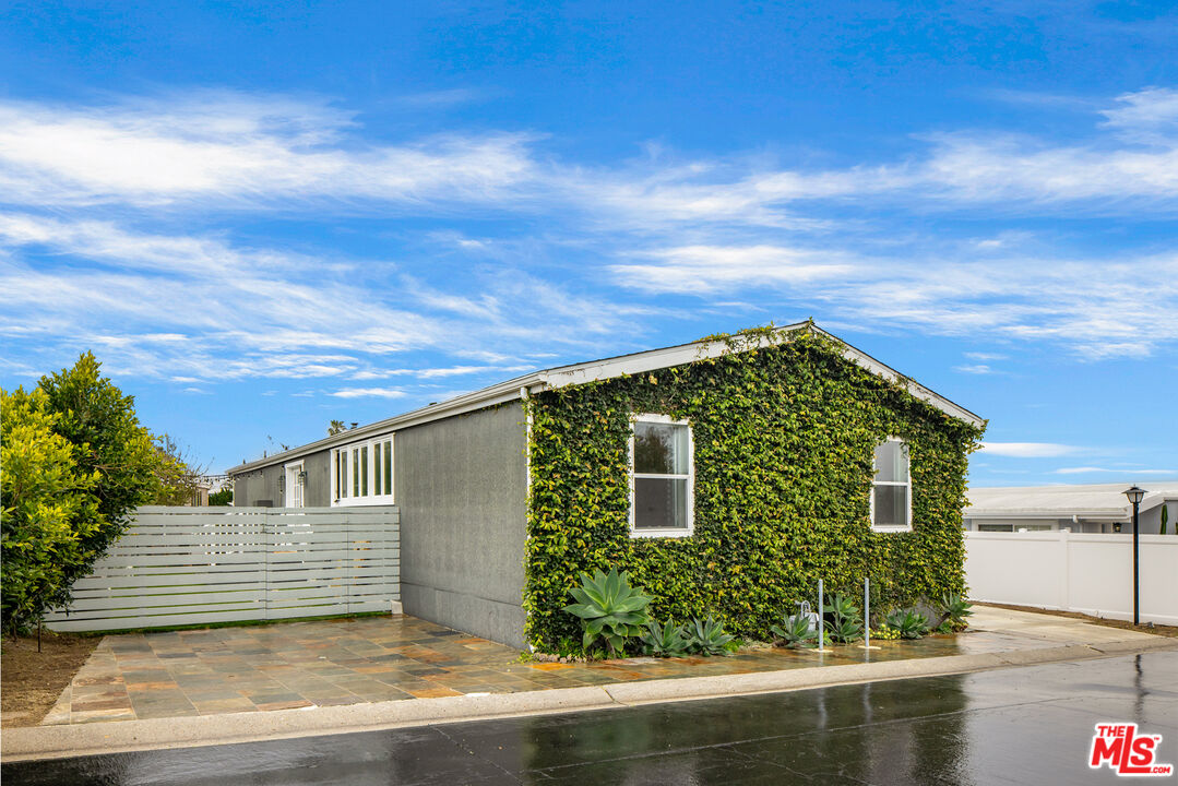 29500 Heathercliff Road, Unit 235 Malibu, CA 90265 - Photo 31 of 32 a front view of a house with a garden