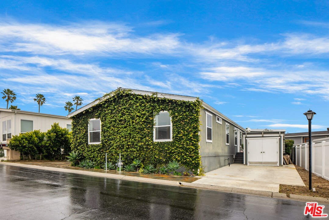 29500 Heathercliff Road, Unit 235 Malibu, CA 90265 - Photo 32 of 32 a front view of a house with a yard