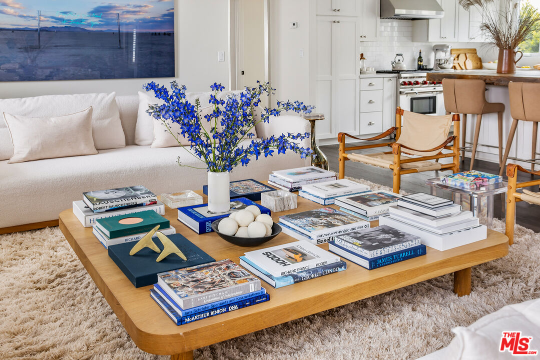 29500 Heathercliff Road, Unit 235 Malibu, CA 90265 - Photo 5 of 32 a living room with furniture and flowers