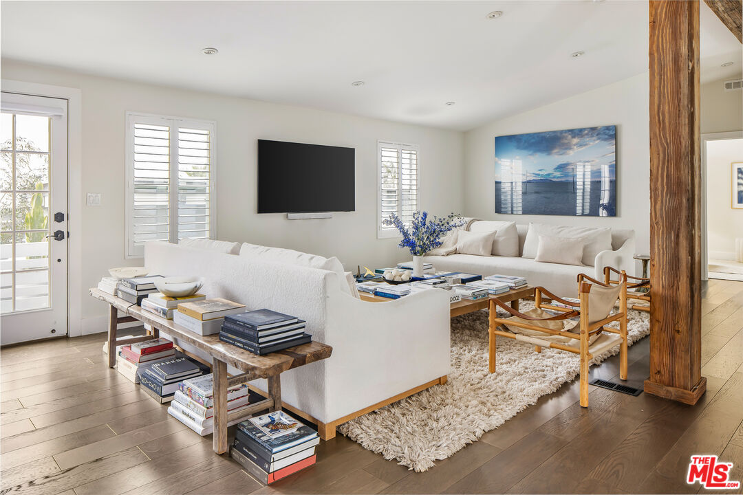 29500 Heathercliff Road, Unit 235 Malibu, CA 90265 - Photo 6 of 32 a living room with furniture and a flat screen tv