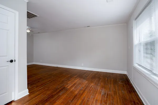a dining room with table and chairs