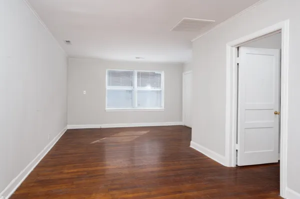 a view of a livingroom with furniture and wooden floor