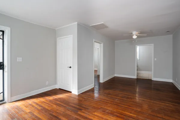 a bedroom with bed and a window