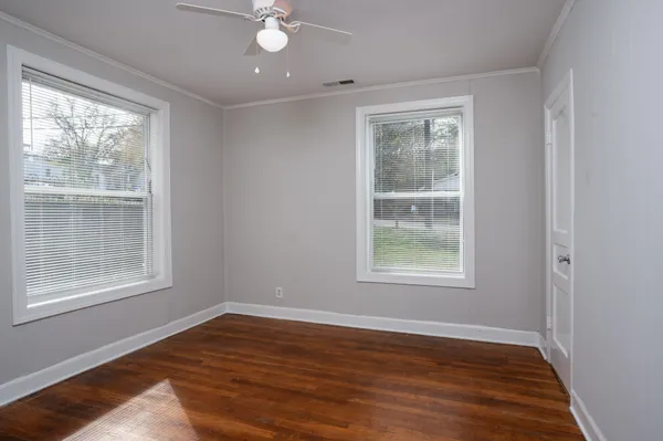 a bedroom with bed and window