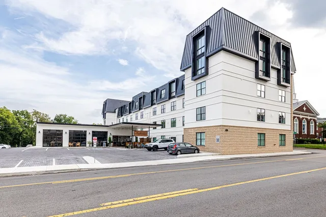 a view of a building with a street