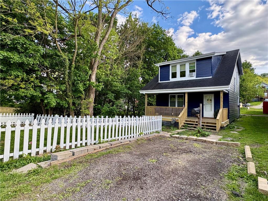 1416 Ridge Avenue Coraopolis, PA 15108 - Photo 1 of 24 a front view of a house with garden