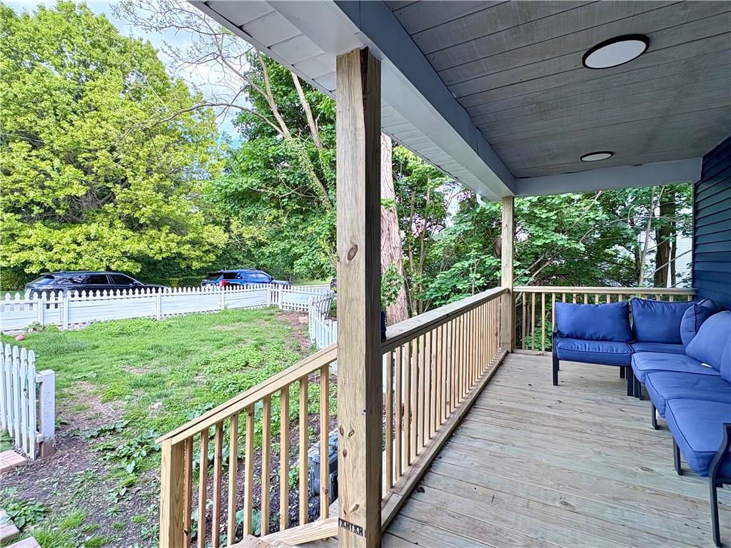 1416 Ridge Avenue Coraopolis, PA 15108 - Photo 2 of 24 a view of a deck with a table and chairs next to a yard