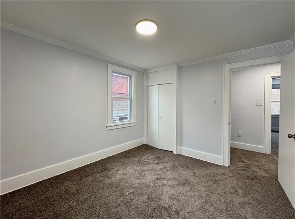 1416 Ridge Avenue Coraopolis, PA 15108 - Photo 22 of 24 an empty room with windows and closet