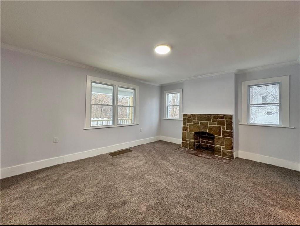 1416 Ridge Avenue Coraopolis, PA 15108 - Photo 4 of 24 an empty room with furniture and a fireplace