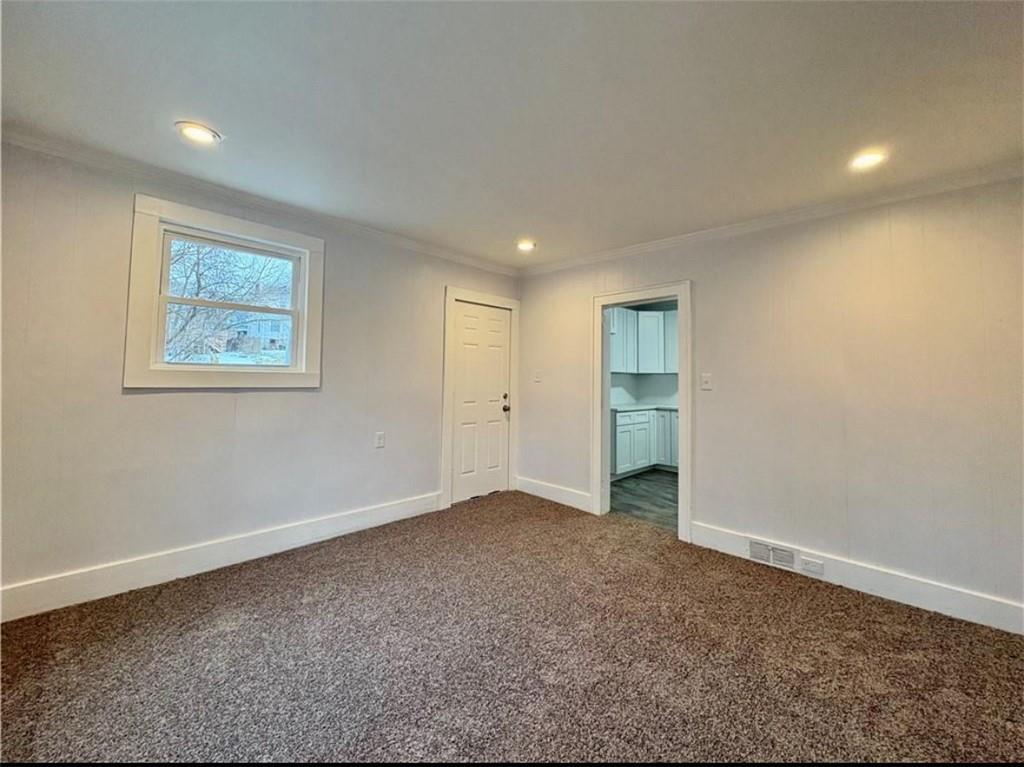 1416 Ridge Avenue Coraopolis, PA 15108 - Photo 8 of 24 an empty room with closet and windows