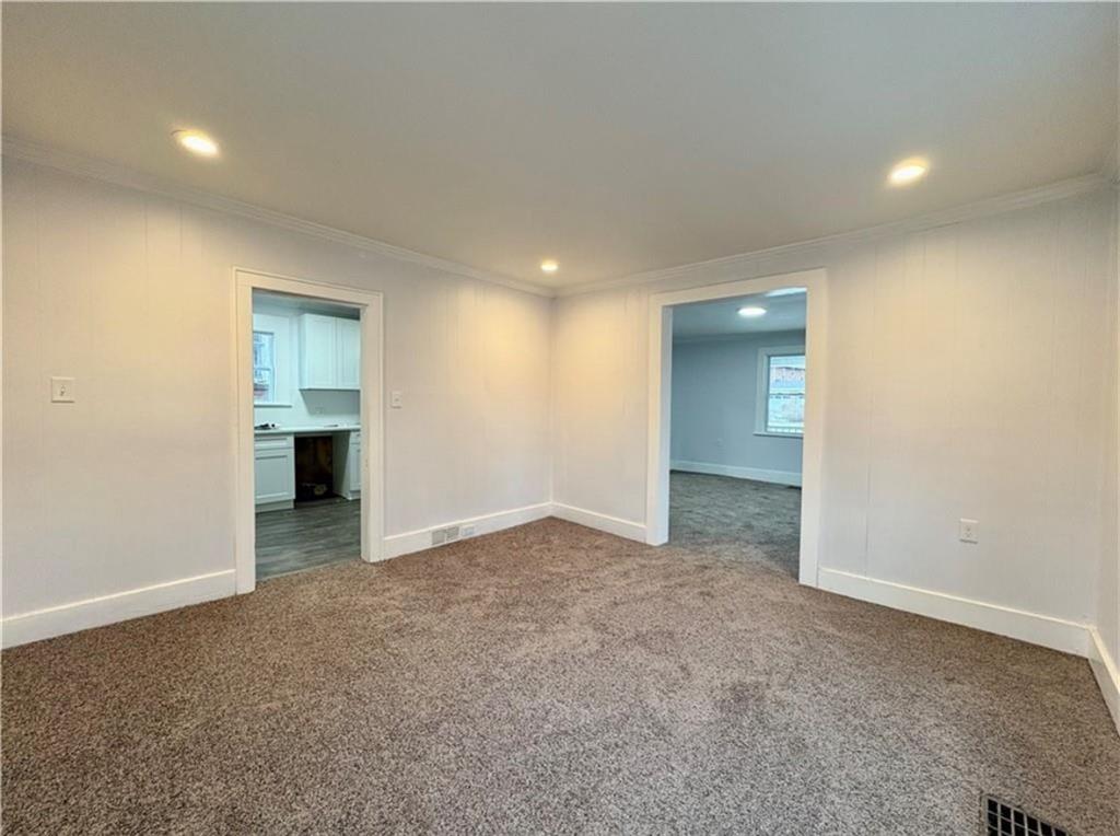 1416 Ridge Avenue Coraopolis, PA 15108 - Photo 9 of 24 an empty room with a bathroom and a sink