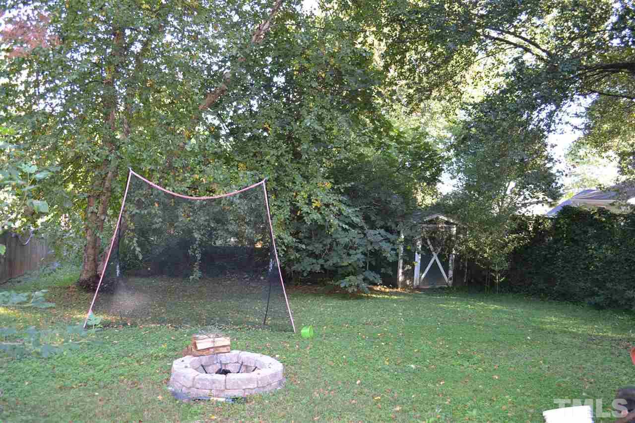 1604 Carson Street Raleigh, NC 27608 - Photo 24 of 28 a backyard of a house with lots of green space