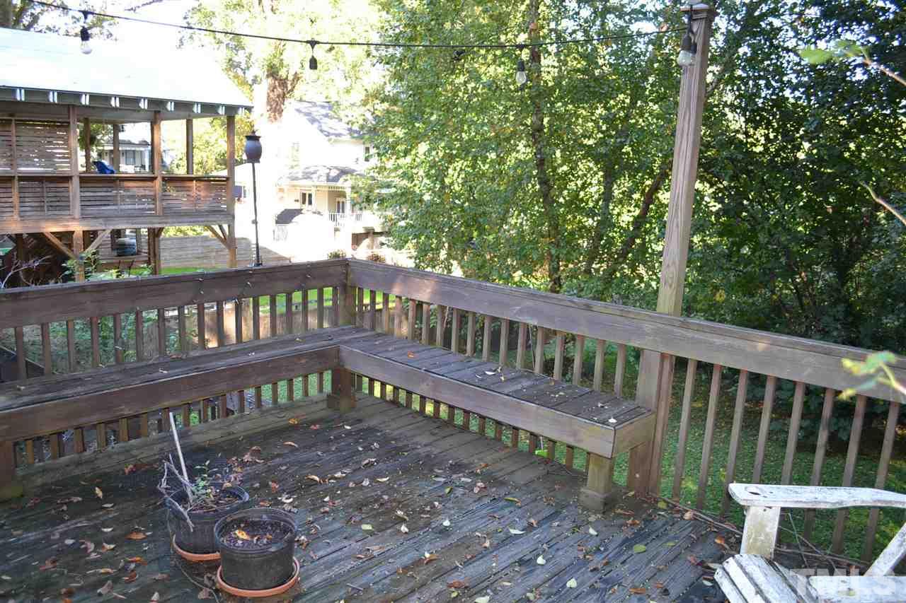 1604 Carson Street Raleigh, NC 27608 - Photo 26 of 28 a view of a wooden bench with two chairs in a patio