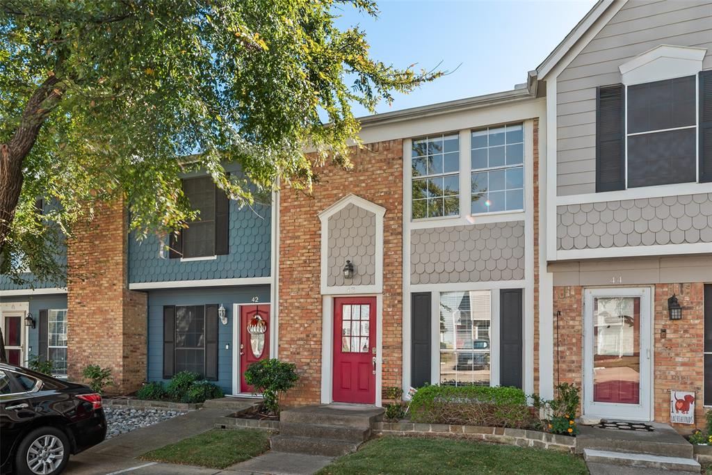 43 Abbey Road Euless, TX 76039 - Photo 2 of 22 front view of a brick house with a yard