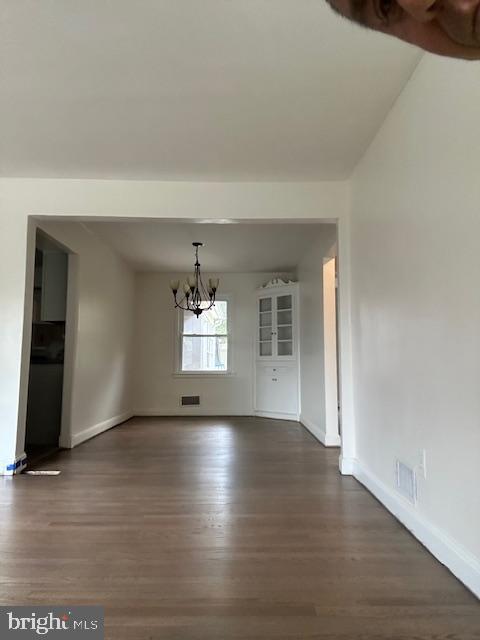 26820 Ridge Road Damascus, MD 20872 - Photo 11 of 25 an empty room with wooden floor and windows