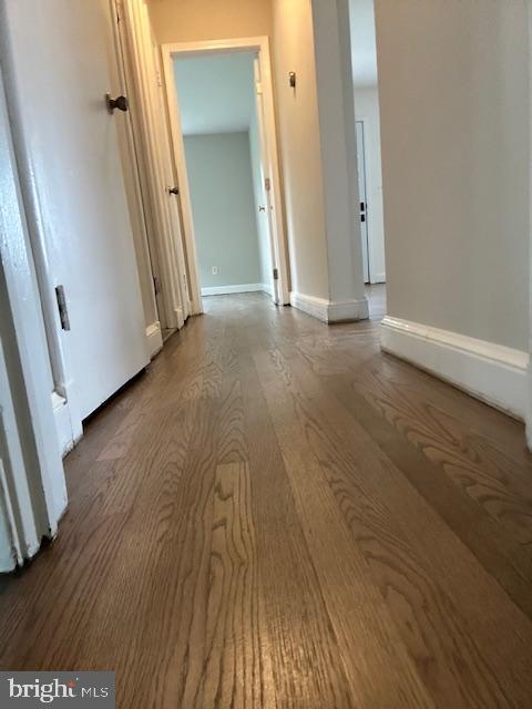 26820 Ridge Road Damascus, MD 20872 - Photo 13 of 25 an empty room with wooden floor and entrance