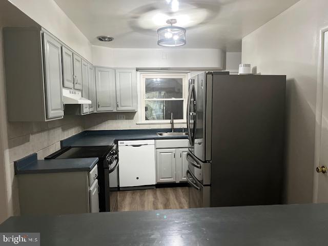 26820 Ridge Road Damascus, MD 20872 - Photo 17 of 25 a kitchen with kitchen island granite countertop cabinets and stainless steel appliances