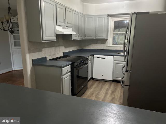 26820 Ridge Road Damascus, MD 20872 - Photo 18 of 25 a kitchen with a sink stove and cabinets