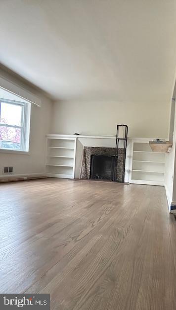 26820 Ridge Road Damascus, MD 20872 - Photo 5 of 25 a room with a bench and a window