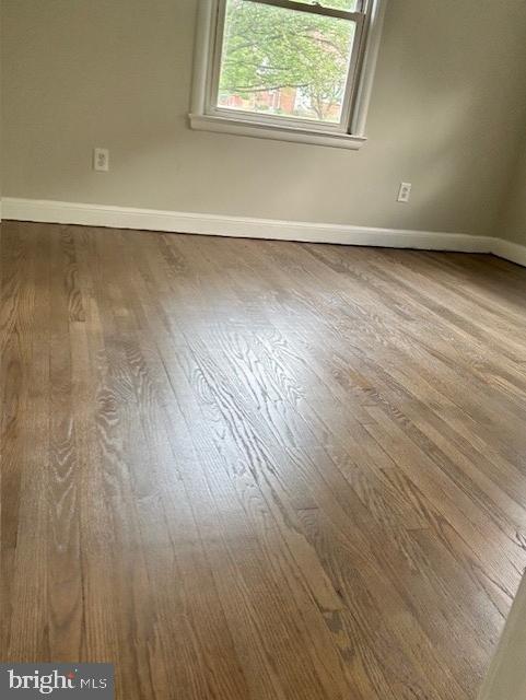 26820 Ridge Road Damascus, MD 20872 - Photo 6 of 25 an empty room with wooden floor and windows