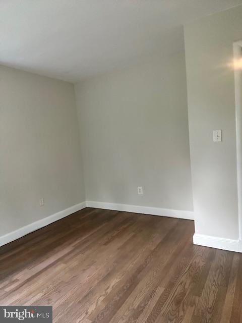 26820 Ridge Road Damascus, MD 20872 - Photo 9 of 25 a view of an empty room with wooden floor