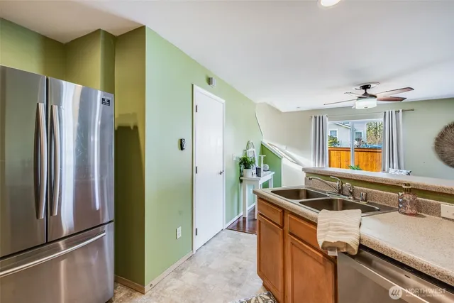 a view of a that has a sink and a refrigerator