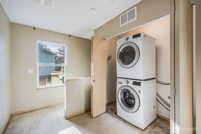 a view of a storage & utility room with a washer and dryer