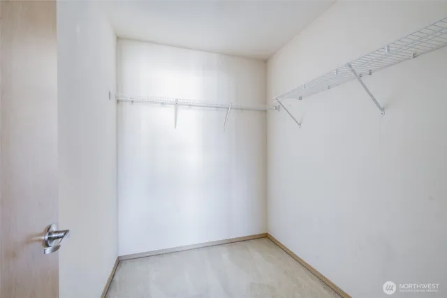 a bathroom with a granite countertop sink mirror and toilet
