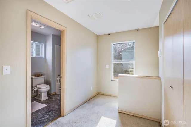 a bathroom with a sink toilet vanity and tub