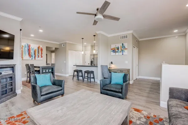 a living room with furniture and a flat screen tv