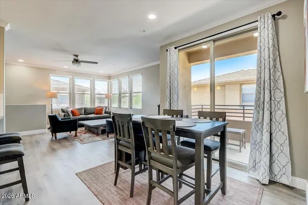 a dining room with furniture and window