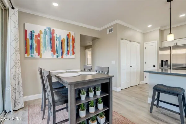 a view of a dining room with furniture and wooden floor
