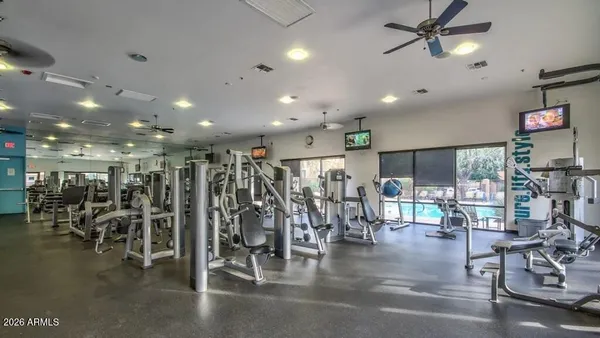 a view of a room with lots of gym equipment