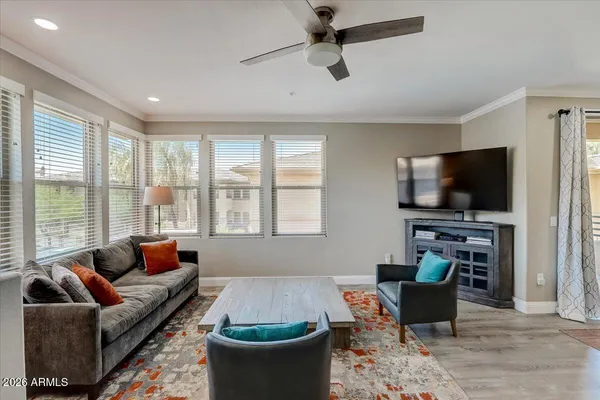 a living room with furniture and a flat screen tv