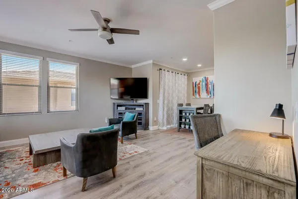 a living room with furniture and a flat screen tv