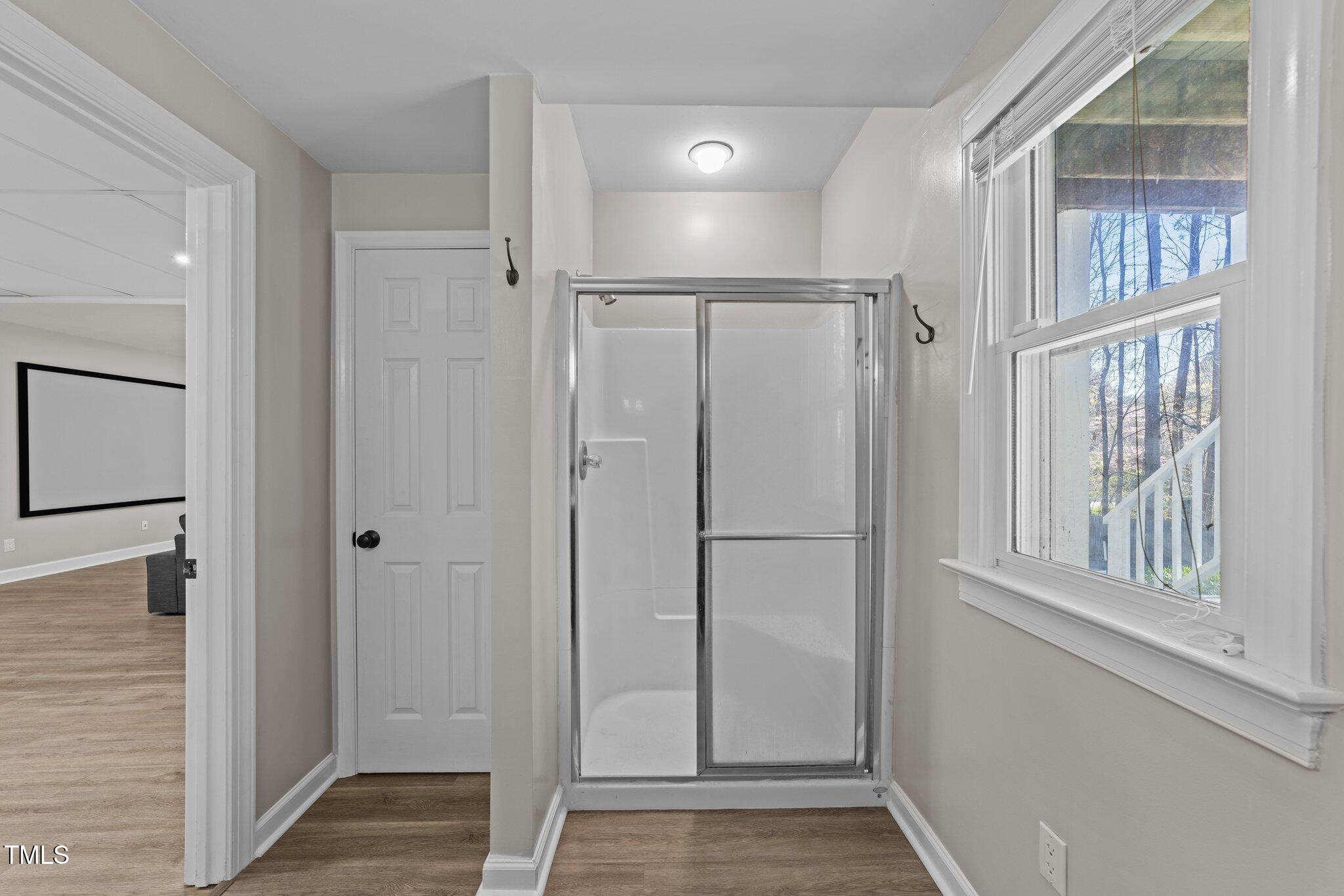5816 Sand Pebble Place Raleigh, NC 27613 - Photo 52 of 74 a view of a hallway with wooden floor and entryway