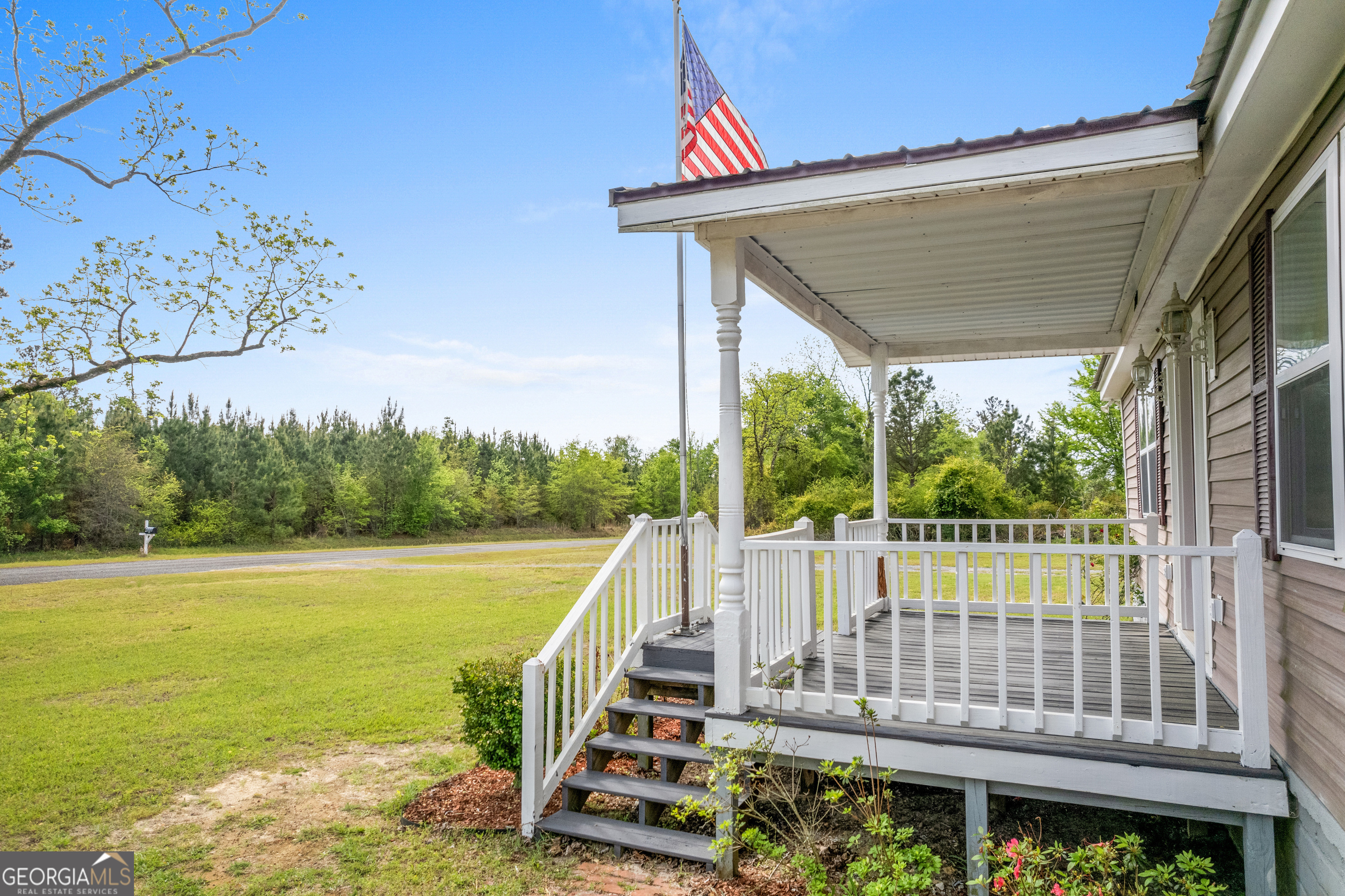 2010 Page Road Harrison, GA 31035 - Photo 13 of 59 a view of a deck with a ocean view