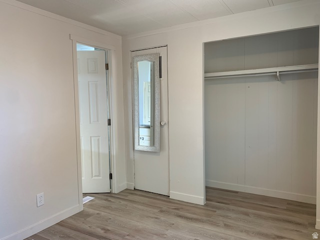 1500 North Angel Street West, Unit 56 Layton, UT 84041 - Photo 17 of 20 Unfurnished bedroom featuring light wood finished floors and ornamental molding