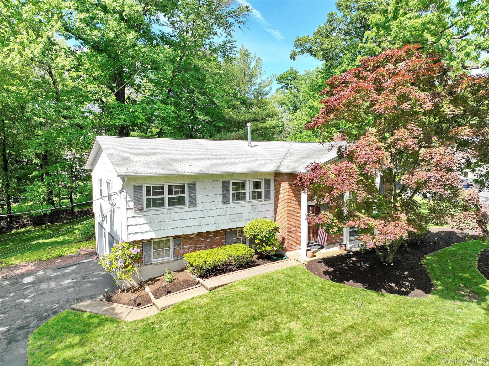 22 Sterling Road Spring Valley, NY 10977 - Photo 2 of 24 a view of a house with backyard porch and sitting area