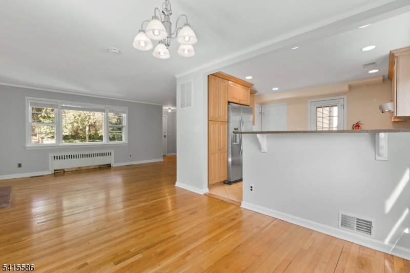 97 McCosh Road Montclair, NJ 07043 - Photo 11 of 25 a view of a kitchen with wooden floor and a window
