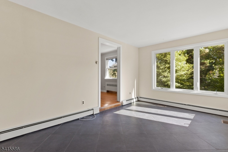 97 McCosh Road Montclair, NJ 07043 - Photo 13 of 25 an empty room with windows