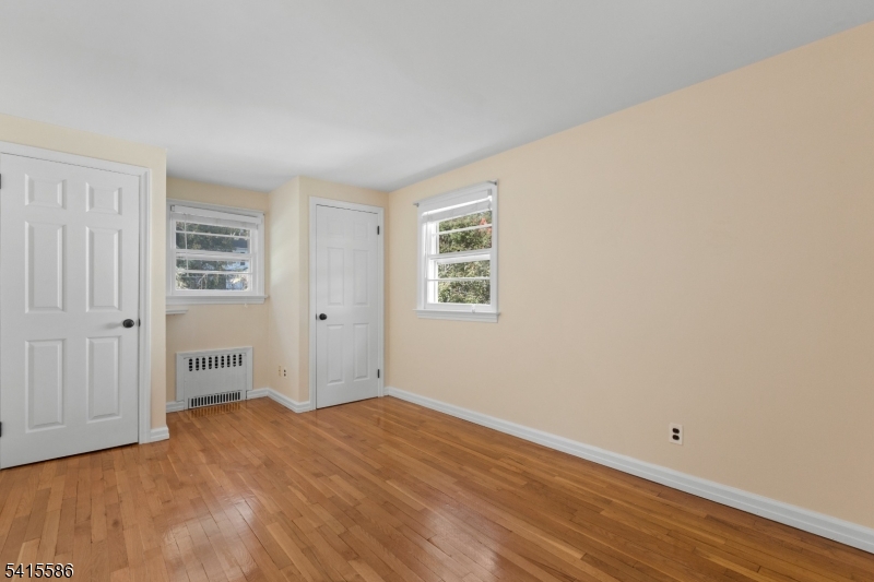 97 McCosh Road Montclair, NJ 07043 - Photo 16 of 25 a view of empty room with wooden floor and entryway