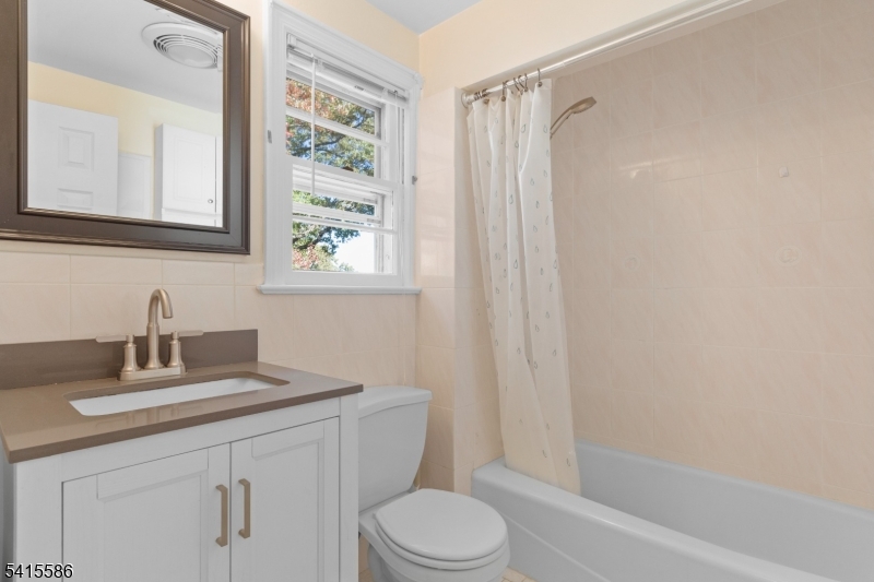 97 McCosh Road Montclair, NJ 07043 - Photo 17 of 25 a bathroom with a sink toilet and shower