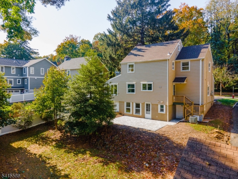97 McCosh Road Montclair, NJ 07043 - Photo 20 of 25 a view of house with backyard and swimming pool