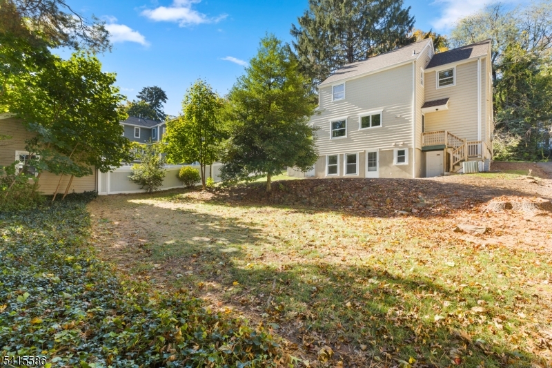 97 McCosh Road Montclair, NJ 07043 - Photo 21 of 25 a view of a yard with a house